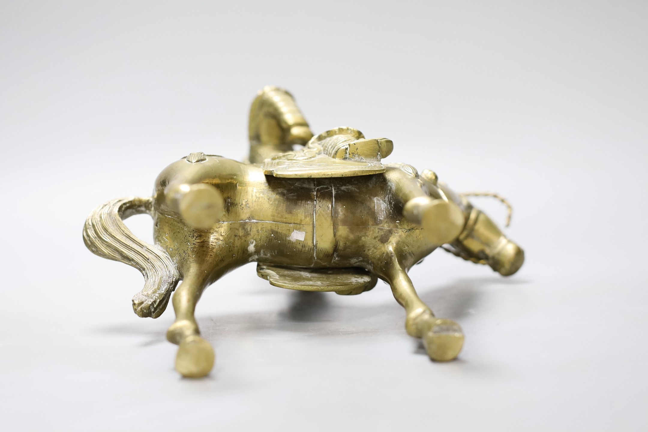 An early 20th century Chinese bronze group of Guandi riding a horse, 24 cms high